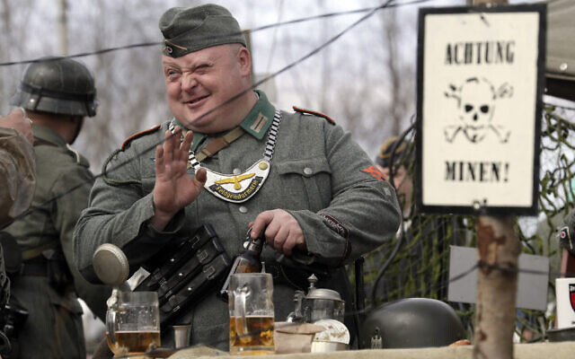 Illustrative: A member of historical military clubs wearing Nazi German uniform speaks prior to a World War II battle reconstruction during a military show 50 km (31 miles) north of Novgorod, Russia, Sunday, April 9, 2017. (AP/Dmitri Lovetsky)