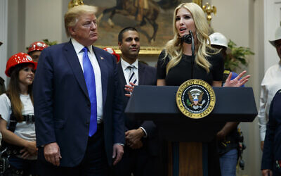 US President Donald Trump listens as Ivanka Trump speaks about the deployment of 5G technology in the United States during an event in the Roosevelt Room of the White House,April 12, 2019, in Washington. (AP Photo/Evan Vucci)
