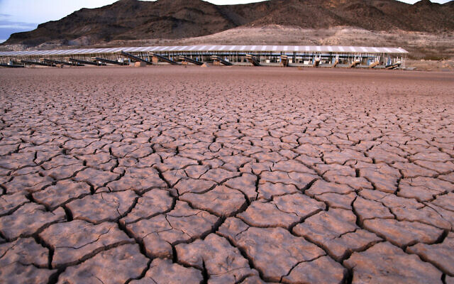In this illustrative photo from July 16, 2014, file photo, what was once a marina sits high and dry due to Lake Mead receding in the Lake Mead National Recreation Area in Arizona. (AP Photo/John Locher, File)