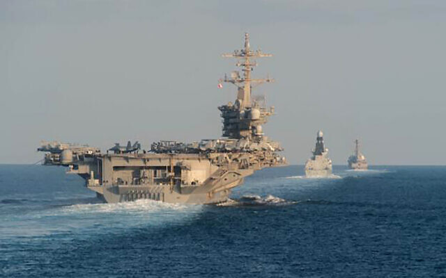 Illustrative: In this photo from the US Navy provided on November 19, 2019, the aircraft carrier USS Abraham Lincoln, left, the air-defense destroyer HMS Defender and the guided-missile destroyer USS Farragut transit the Strait of Hormuz with the guided-missile cruiser USS Leyte Gulf. (Mass Communication Specialist 3rd Class Zachary Pearson/U.S. Navy via AP)