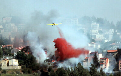 Illustrative: Airplanes and  firefighters try to extinguish a forest fire which raged in Mevaseret Zion, just outside of Jerusalem. July 15, 2012. (Yossi Zamir/Flash 90)
