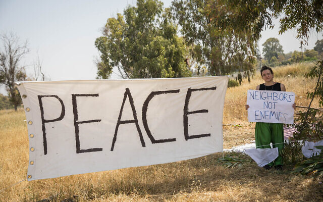 A 'Peace' sign hangs in a field near the border with Gaza, as thousands of Palestinians demonstrate near the border with Israel in the Gaza Strip, on April 6, 2018. (Hadas Parush/Flash90)