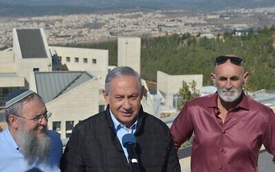(From L-R) Gush Etzion Regional Council chairman Shlomo Ne'eman, Prime Minister Benjamin Netanyahu and Yesha Council chairman David Elhayani in front of a Gush Etzion lookout point in the West Bank on November 19, 2019. (Haim Zach/GPO)