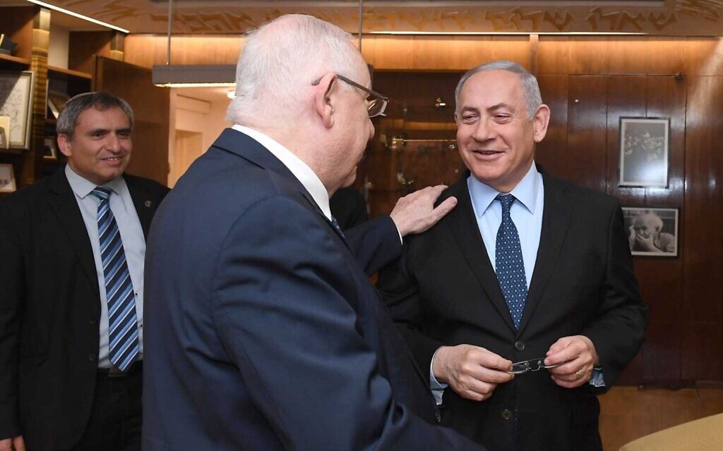 President Reuven Rivlin (C) meets with Prime Minister Benjamin Netanyahu (R) at his official residence in Jerusalem on November 19, 2019. In the background is Likud coalition negotiator Ze'ev Elkin. (Mark Neiman/GPO)