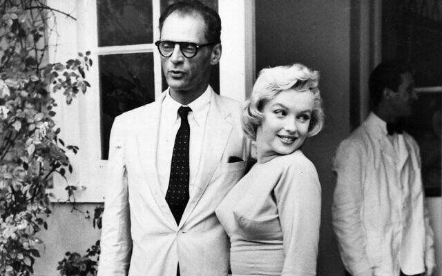 Arthur Miller and Marilyn Monroe in 1956. The playwright's parents bought a menorah for the film icon. (ullstein bild via Getty Images, via JTA)