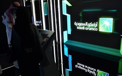 In this photo from November 13, 2019, visitors stop at the Aramco exhibition section at the Misk Global Forum on innovation and technology held in Riyadh, Saudi Arabia. (Fayez Nureldine/AFP)