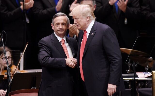 President Donald Trump is greeted by Pastor Robert Jeffress at the Celebrate Freedom Rally at the John F. Kennedy Center for the Performing Arts in Washington, July 1, 2017. (Olivier Douliery/Pool/ Getty Images via JTA)