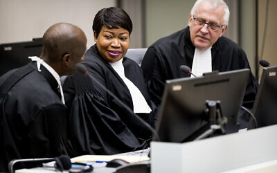 Prosecutor Fatou Bensouda, center, and Deputy Prosecutor James Stewart, right, attend the first audience with the chief of Central African Republic’s soccer federation Patrice-Edouard Ngaissona at the International Criminal Court (ICC) in The Hague, the Netherlands on January 25, 2019. (Koen Van Well/Pool photo via AP)