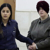 Malka Leifer, right, is brought to a courtroom in Jerusalem, on February 27, 2018. (AP Photo/Mahmoud Illean, File)