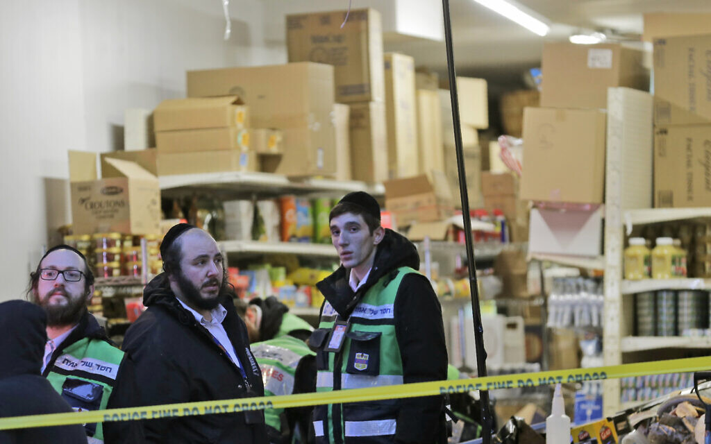 Emergency responders work at a kosher supermarket, the site of a shooting in Jersey City, New Jersey, December 11, 2019. (AP Photo/Seth Wenig)