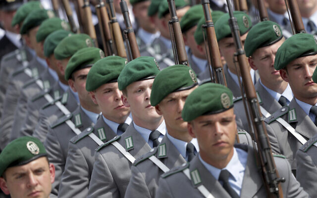 Soldiers attend an oath-taking ceremony of the German army at the Defence Ministry in Berlin, Germany, July 20, 2019. (AP Photo/Michael Sohn)