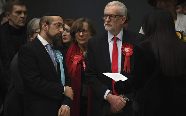 British opposition Labour Party leader Jeremy Corbyn, right, waits for the declaration of his seat in the 2019 general election in Islington, London, December 13, 2019 (AP Photo/Alberto Pezzali)