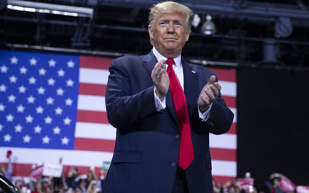 US President Donald Trump arrives to speak during a campaign rally at Kellogg Arena, Wednesday, Dec. 18, 2019, in Battle Creek, Mich. (AP Photo/ Evan Vucci)