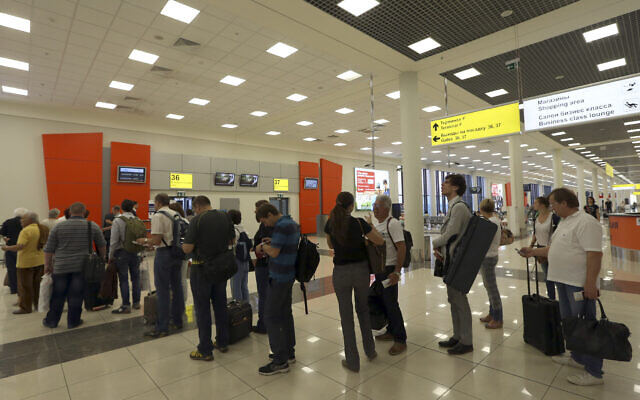 Illustrative: Passengers stand waiting at Sheremetyevo Airport in Moscow, June 27, 2013. (Sergei Grits/AP)