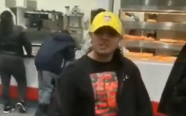A screen capture from video of a man, identified as Justin Pichizaca, threatening a rabbi at a Costco in Lawrence, Long Island. (Screen capture: Twitter)