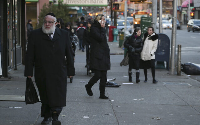 Illustrative: Ultra-Orthodox Jews seen walking on a street in New York City on January 1, 2014. (Nati Shohat/Flash 90/File)
