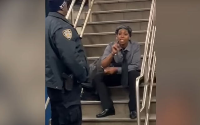 A woman, identified by the New York Police Department as Zarinah Ali, rants against Jews at a subway station in New York on December 12, 2019. (Screen capture: YouTube)