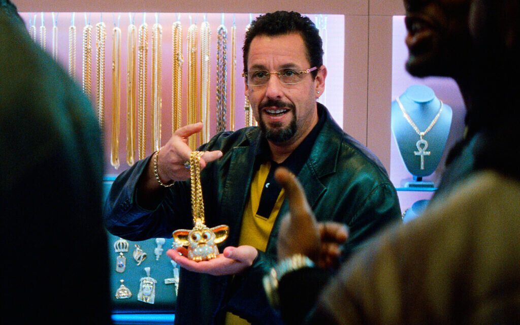 This image released by A24 shows Adam Sandler in a scene from "Uncut Gems." (A24 via AP)