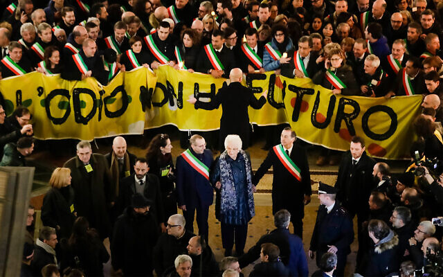 Liliana Segre, an 89-year-old Auschwitz survivor and senator-for-life, center, attends an anti-racism demonstration in Milan's Victor Emmanuel II arcade in northern Italy joined by mayors of some 600 Italian towns, December 10, 2019. (AP Photo/Luca Bruno)