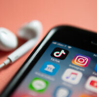 Illustrative: An iPhone loaded with TikTok and other social media application icons. (Wachiwit/iStock)
