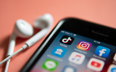 Illustrative: An iPhone loaded with TikTok and other social media application icons. (Wachiwit/iStock)