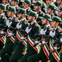 Illustrative: This photo taken on September 22, 2018, shows members of Iran's Revolutionary Guards Corps (IRGC) marching during the annual military parade that marks the anniversary of the outbreak of the devastating 1980-1988 war with Saddam Hussein's Iraq, in the capital Tehran. (Stringer/AFP)
