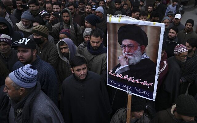 A protester holds a poster with an image of Iranian leader Ayatollah Ali Khamenei during a demonstration against the United States following a US airstrike in Iraq that killed top Iranian commander Qassem Soleimani, in the Kashmiri town of Magam on January 3, 2020. (Tauseef MUSTAFA/AFP)