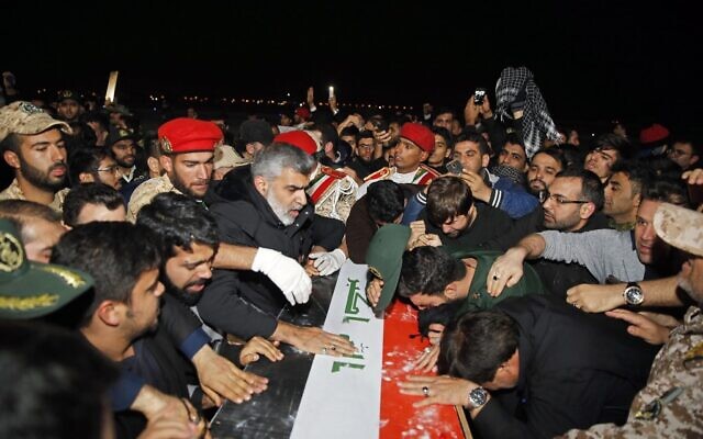People carry the casket of Iranian commander Qassem Soleimani upon arrival at Ahvaz International Airport in Iran on January 5, 2020. (HOSSEIN MERSADI/Fars News/AFP)
