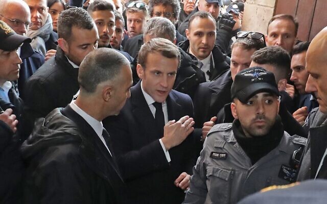 French President Emmanuel Macron asks Israeli police to leave the 12th-century Church of Saint Anne in the Old City of Jerusalem on January 22, 2020. (Ludovic Marin/AFP)