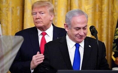 US President Donald Trump, left, and Prime Minister Benjamin Netanyahu take part in an announcement of Trump's Middle East peace plan in the East Room of the White House in Washington, DC on January 28, 2020. (Mandel Ngan/AFP)