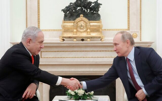 File: Russian President Vladimir Putin  (right) meets with then-Prime Minister Benjamin Netanyahu at the Kremlin in Moscow on January 30, 2020. (MAXIM SHEMETOV / POOL / AFP)