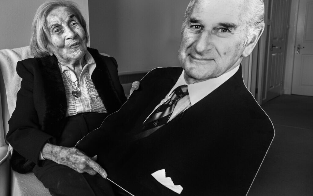 Judith Rosenberg, in her Glasgow, Scotland apartment holding a cardboard cut-out of her husband Harold, who found her and liberated her from Auschwitz. She is 93 (Courtesy Judah Passow/The Lonka Project)