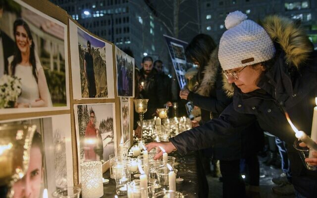 Members of Montreal's Iranian community attend a vigil, Thursday, Jan. 9, 2019 in downtown Montreal (Andrej Ivanov/The Canadian Press via AP)