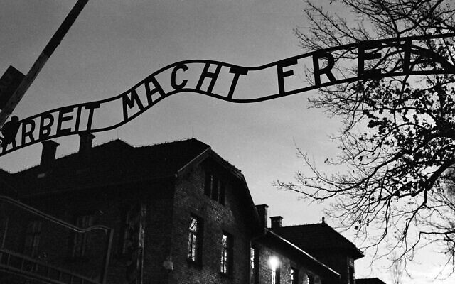 The main entrance at the former Nazi death camp of Auschwitz in Oswiecim, Poland, with the inscription, 'Arbeit Macht Frei', which translates into English as 'Work will set you Free,' December 8, 2019. (Markus Schreiber/AP)