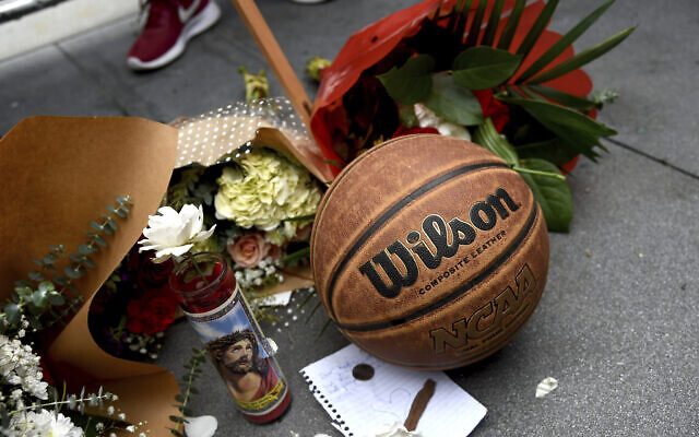 A makeshift memorial honoring former NBA basketball player Kobe Bryant appears outside of Staples center prior to the start of the 62nd annual Grammy Awards on Sunday, Jan. 26, 2020, in Los Angeles. Bryant died Sunday in a helicopter crash near Calabasas, Calif. He was 41. (AP Photo/Chris Pizzello)