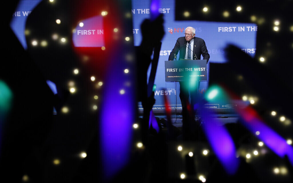 In this November 17, 2019 file photo, Democratic presidential candidate Sen. Bernie Sanders, I-Vt., speaks as supporters wave lighted signs during a fundraiser for the Nevada Democratic Party in Las Vegas.(AP/John Locher)