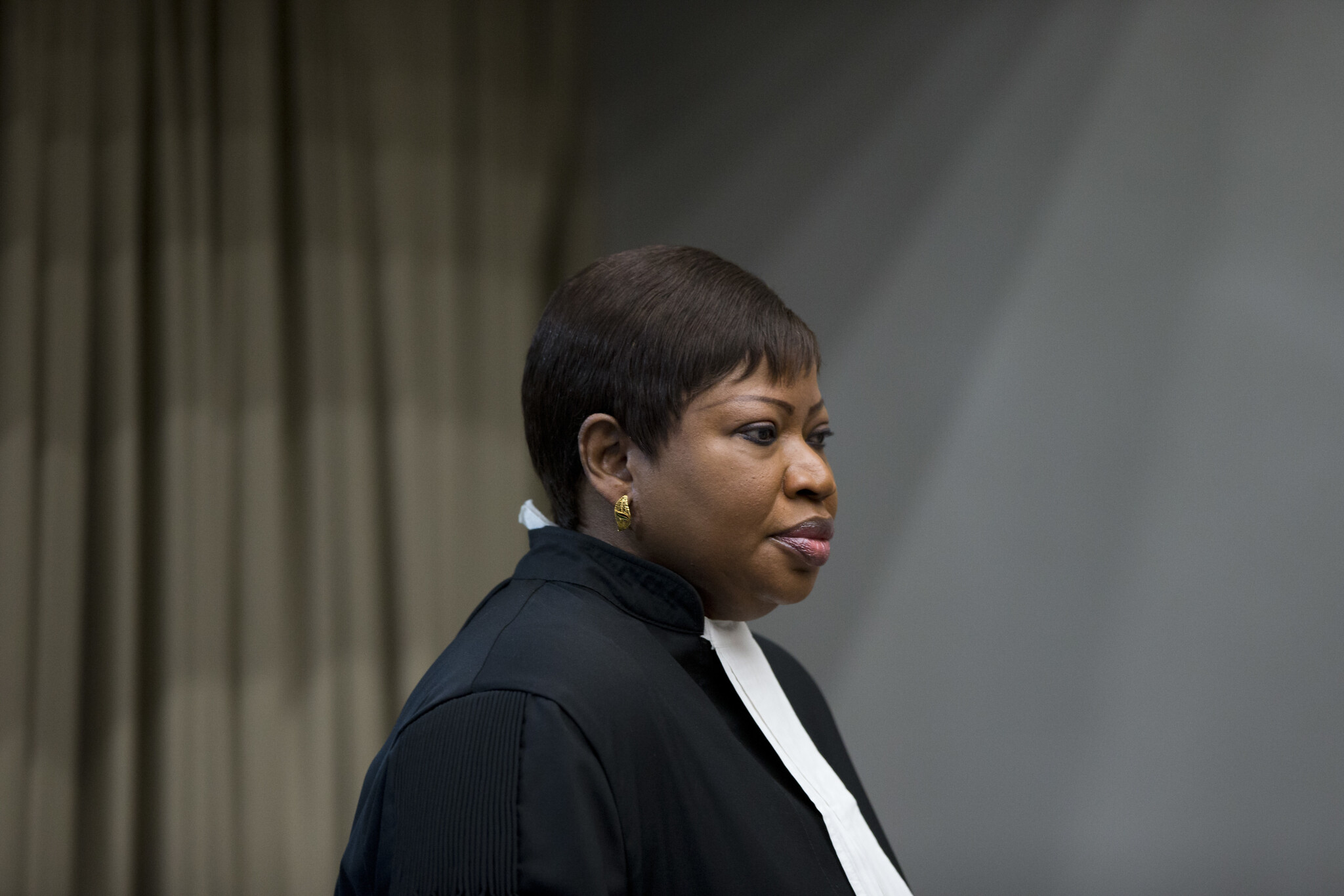 Public Prosecutor Fatou Bensouda enters the courtroom for the trial of Dominic Ongwen, a senior commander in the Lord's Resistance Army, whose fugitive leader Kony is one of the world's most-wanted war crimes suspects, at the International Court in The Hague, Netherlands, December 6, 2016. (AP Photo/Peter Dejong, Pool)