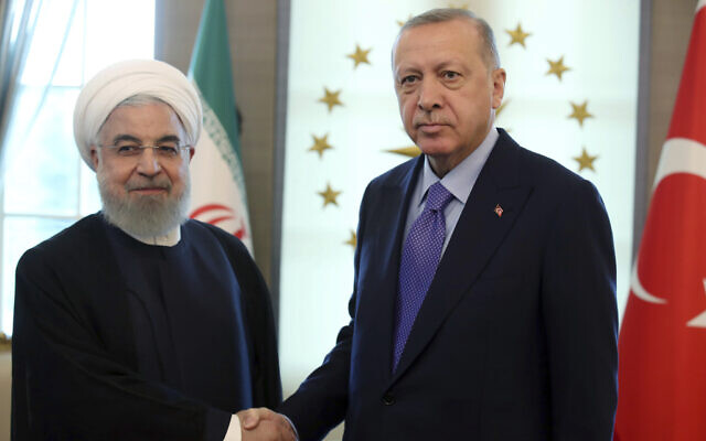 Turkish President Recep Tayyip Erdogan, right, greets Iran's President Hassan Rouhani before a meeting at the Cankaya Palace, in Ankara, Turkey, September 16, 2019. (Presidential Press Service via AP, Pool)