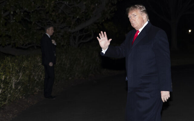 US President Donald Trump waves after stepping off Marine One on the South Lawn of the White House, in Washington, January 9, 2020. (Alex Brandon/AP)