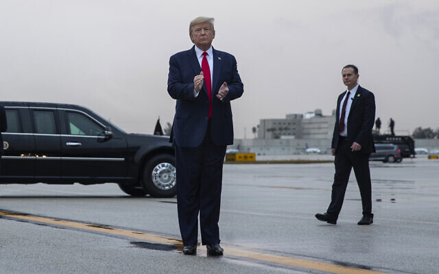 US President Donald Trump pauses as he arrives at Miami International Airport en route to attend the Republican National Committee winter meetings, Thursday, January 23, 2020, in Miami. (AP/ Evan Vucci)