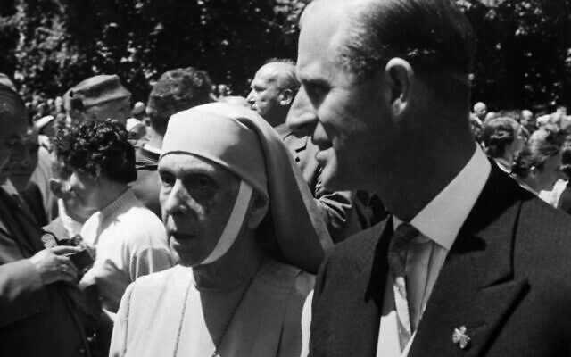 Britain's Prince Philip escorts his mother, Princess Alice Andreeas of Greece, in wedding procession of Princess Margarita of Baden and Prince Tomislav of Yugoslavia after the religious ceremonies on June 5, 1957 at Salem, Germany. (AP Photo)