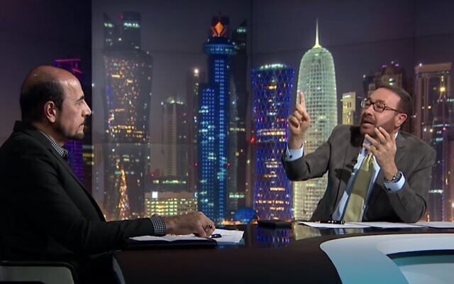 Al Jazeera presenter Faisal al-Qassem interviews former Iranian diplomat Amir Mousawi, January 7, 2019. (Screen capture: YouTube)