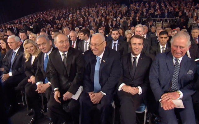 Russian President Vladimir Putin takes his seat at the World Holocaust Forum at Yad Vashem in Jerusalem on January 23, 2020, as other world leaders look on. (Screenshot)
