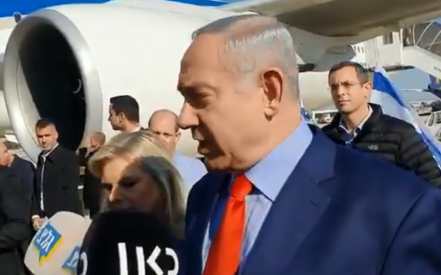 Prime Minister Benjamin Netanyahu speaks to reporters at Ben Gurion Airport before boarding a flight to Washington, Janaury 26, 2019. (Screen capture: Twitter)