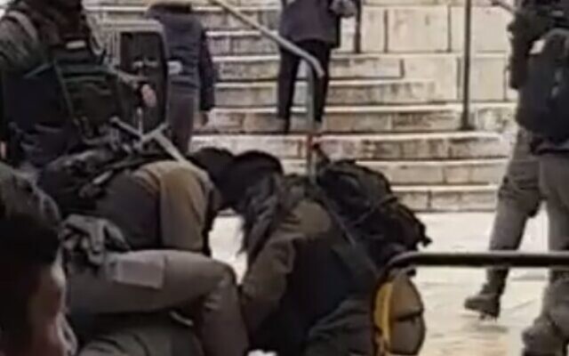 Border Police officers restrain a woman said to have attempted to carry out a stabbing attack at Jerusalem Old City's Damascus Gate, January 18, 2020 (Screen grab via Twitter)