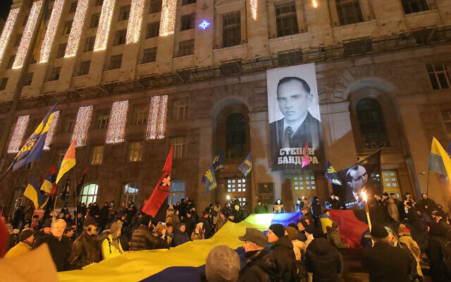 Marchers rally outside the Kyiv City State Administration during the torchlight procession of honor, dignity and freedom on the 111th birthday anniversary of OUN-B (Organization of Ukrainian Nationalists) leader Stepan Bandera, Kyiv, January 1, 2020 (Pavlo_Bagmut/ Ukrinform / Barcroft Media via Getty Images, JTA)