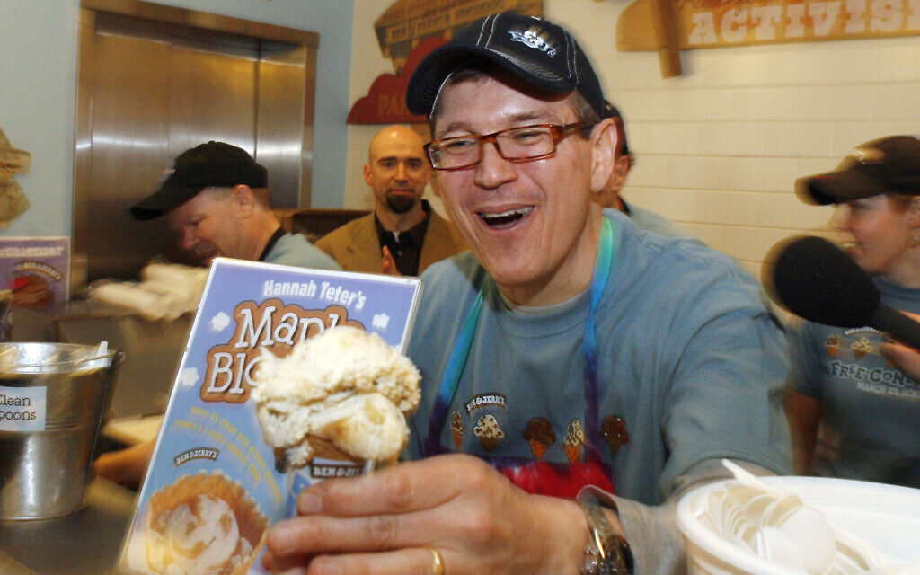 Newly appointed CEO Jostein Solheim serves a cone at the Ben & Jerry's ice cream scoop shop in Burlington, Vermont, Tuesday, March 23, 2010. (AP Photo/Toby Talbot)