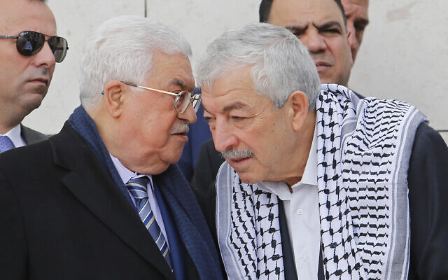 Palestinian Authority President Mahmoud Abbas, left, speaks to senior Fatah official Mahmoud Al-Aloul at the tomb of late Palestinian leader Yasser Arafat inside the Mukataa compound, in the West Bank city of Ramallah, Nov. 11, 2018. (AP Photo/Nasser Shiyoukhi)