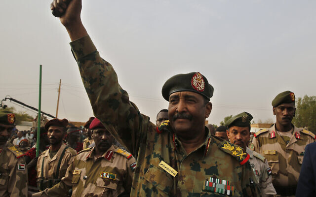Sudanese Gen. Abdel-Fattah Burhan waves to his supporters at a military-backed rally in Omdurman district west of Khartoum, Sudan, June 29, 2019. (AP Photo/Hussein Malla)