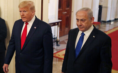 US President Donald Trump and Israeli Prime Minister Benjamin Netanyahu arrive for an event in the East Room of the White House at which Trump presented his Israeli-Palestinian peace proposal, Tuesday, Jan. 28, 2020, in Washington. (AP Photo/Alex Brandon)